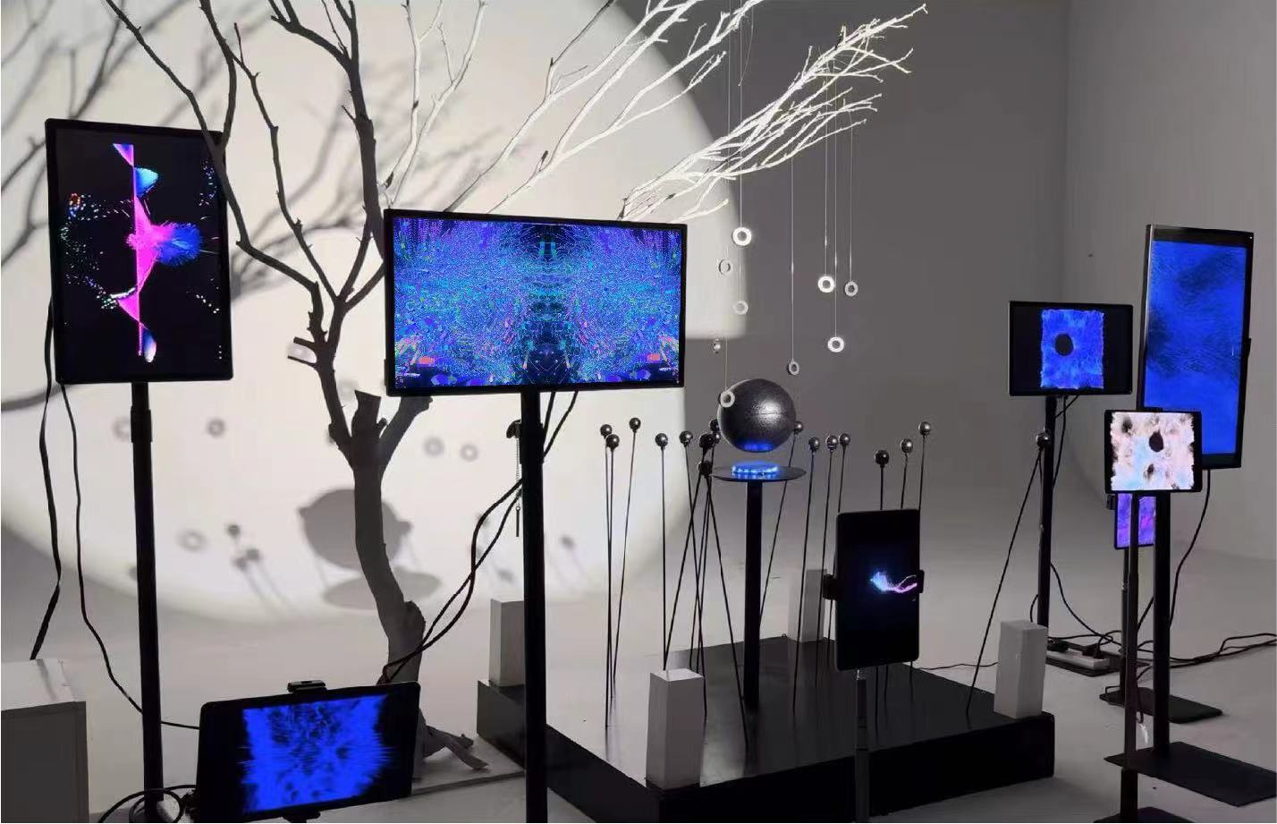 The complete Resonant Interweaving installation with branching forms, magnetic elements and multiple screens